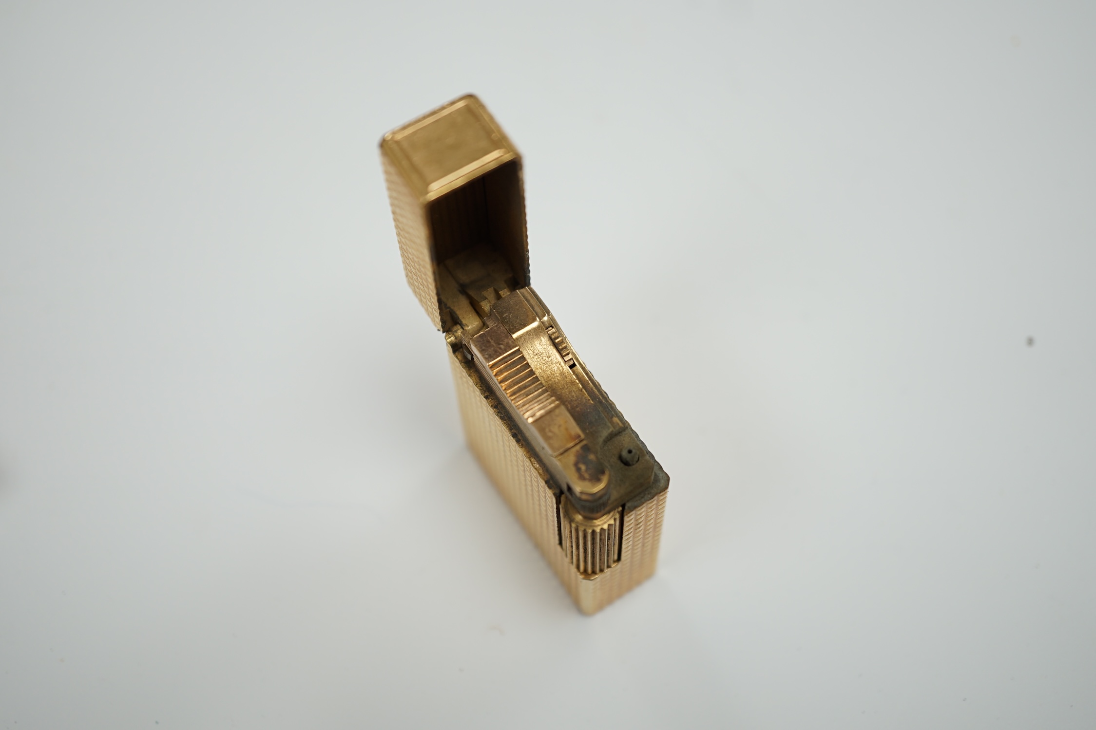 A cased gold plated Dupont lighter with booklet